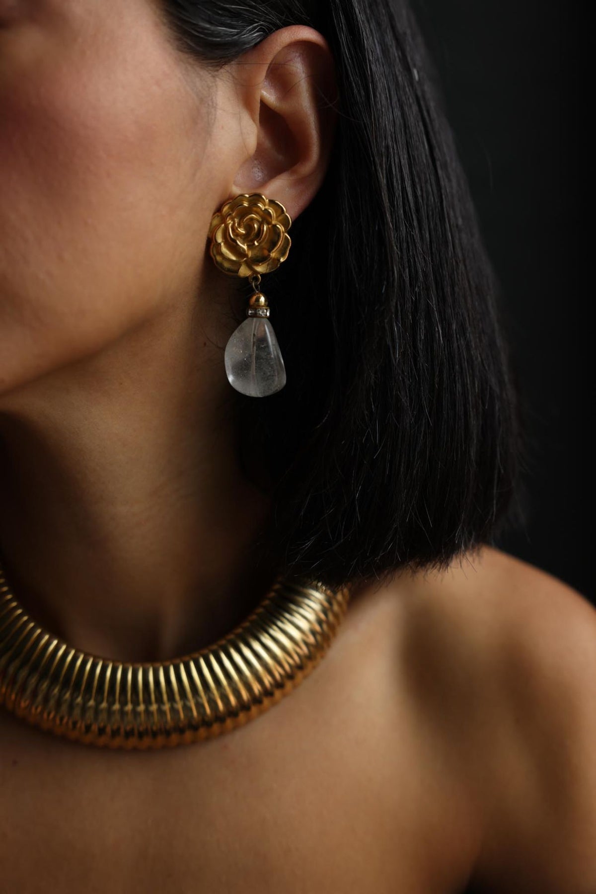 Gold plated rose clear stone drop clip-on earring worn